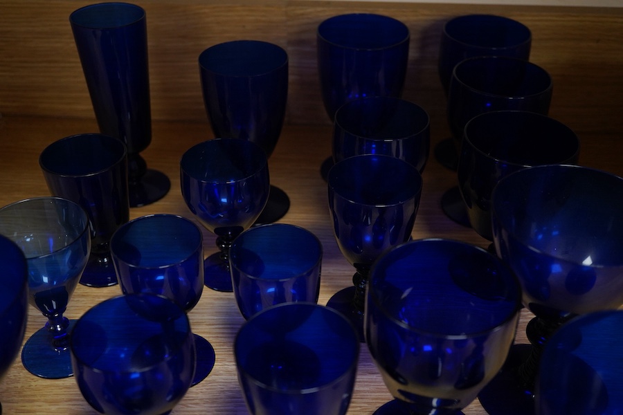 A collection of 19th century and later Bristol blue drinking glasses of various sizes, largest 16cm high